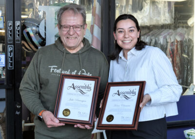 Owner Jake and Julia Estrada hold California Legislature Assembly Certificates of Recognition to Jake and Kenn Cleaners