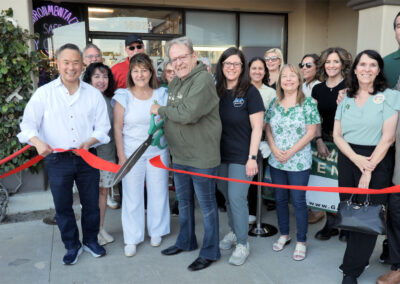 Ribbon cutting with 17 people
